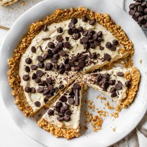 peanut butter pie in a pie pan topped with chocolate chips