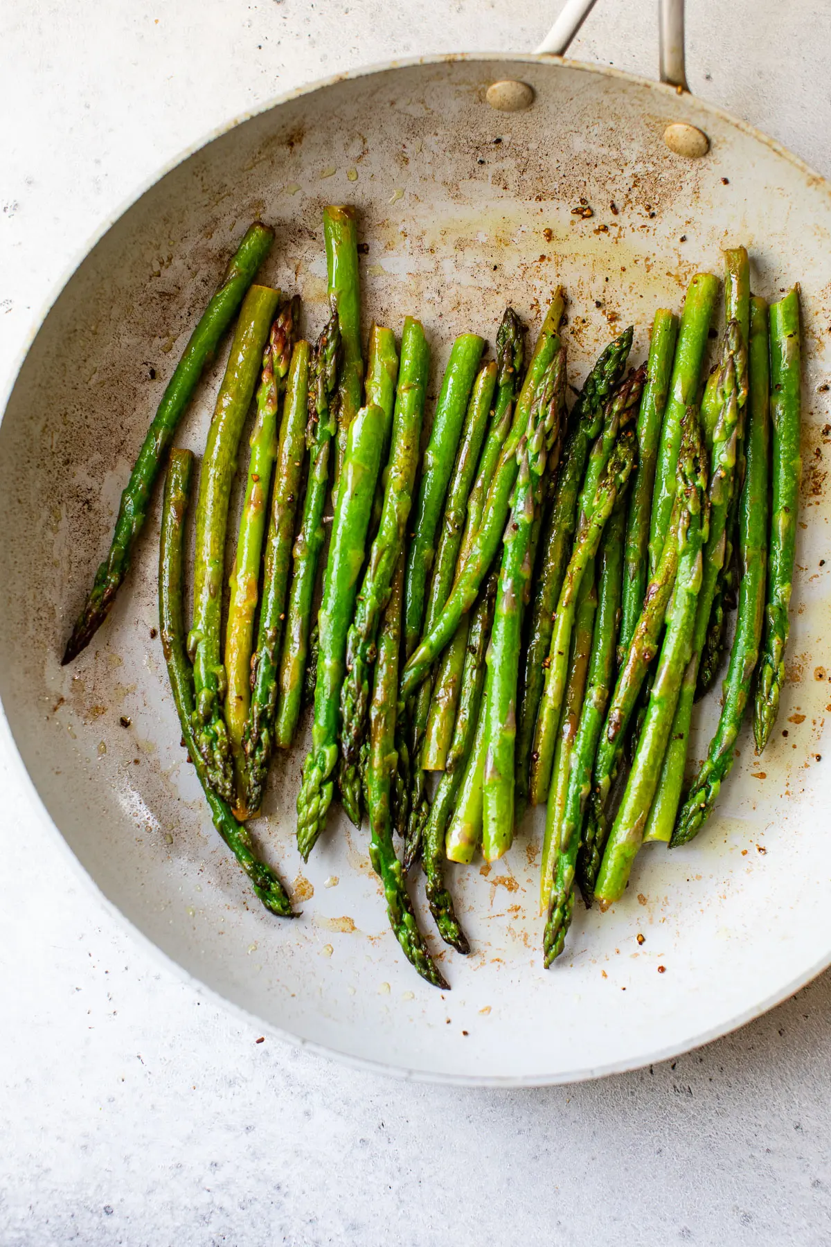 cooked asparagus in a skillet