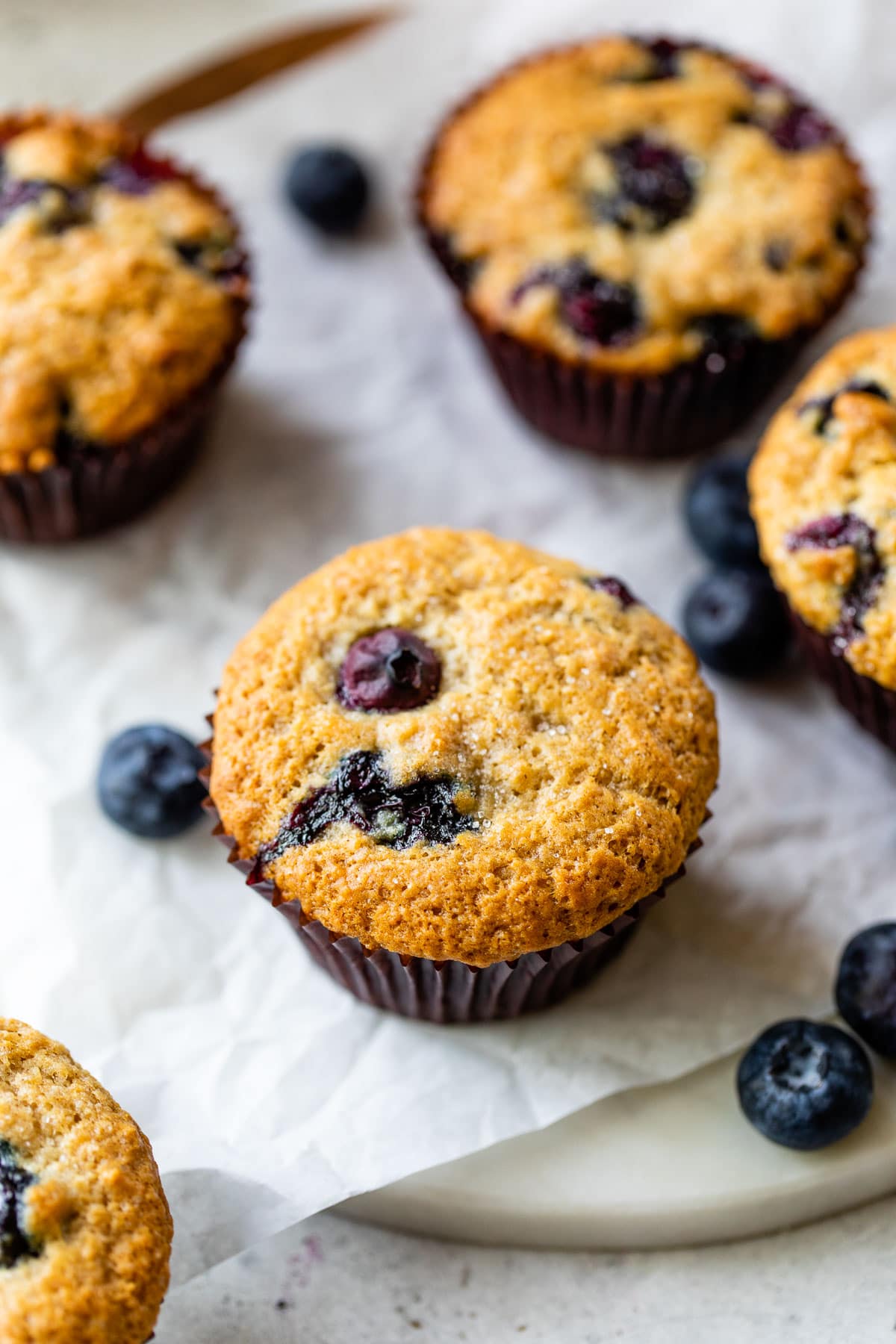 blueberry muffins on parchment paper