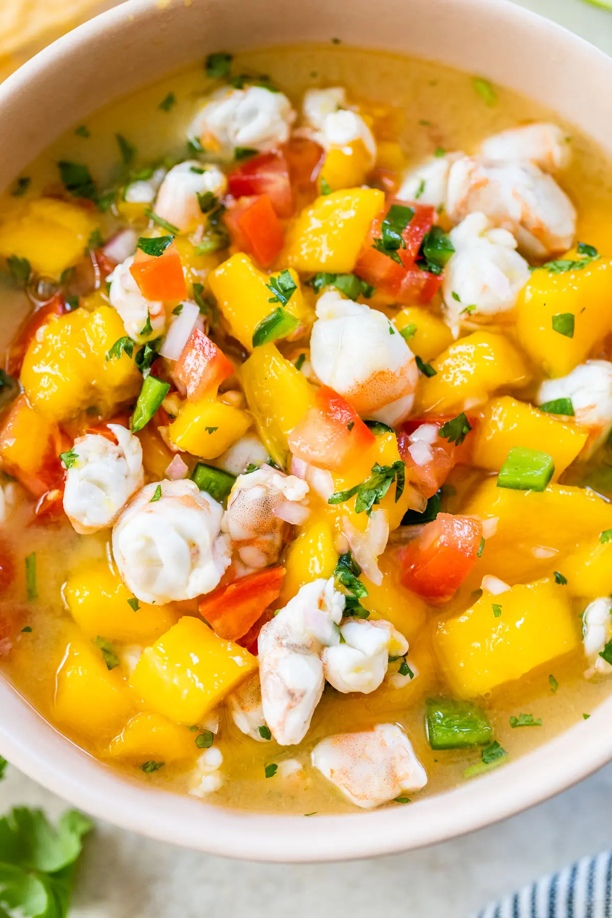 mango shrimp ceviche in a pink bowl