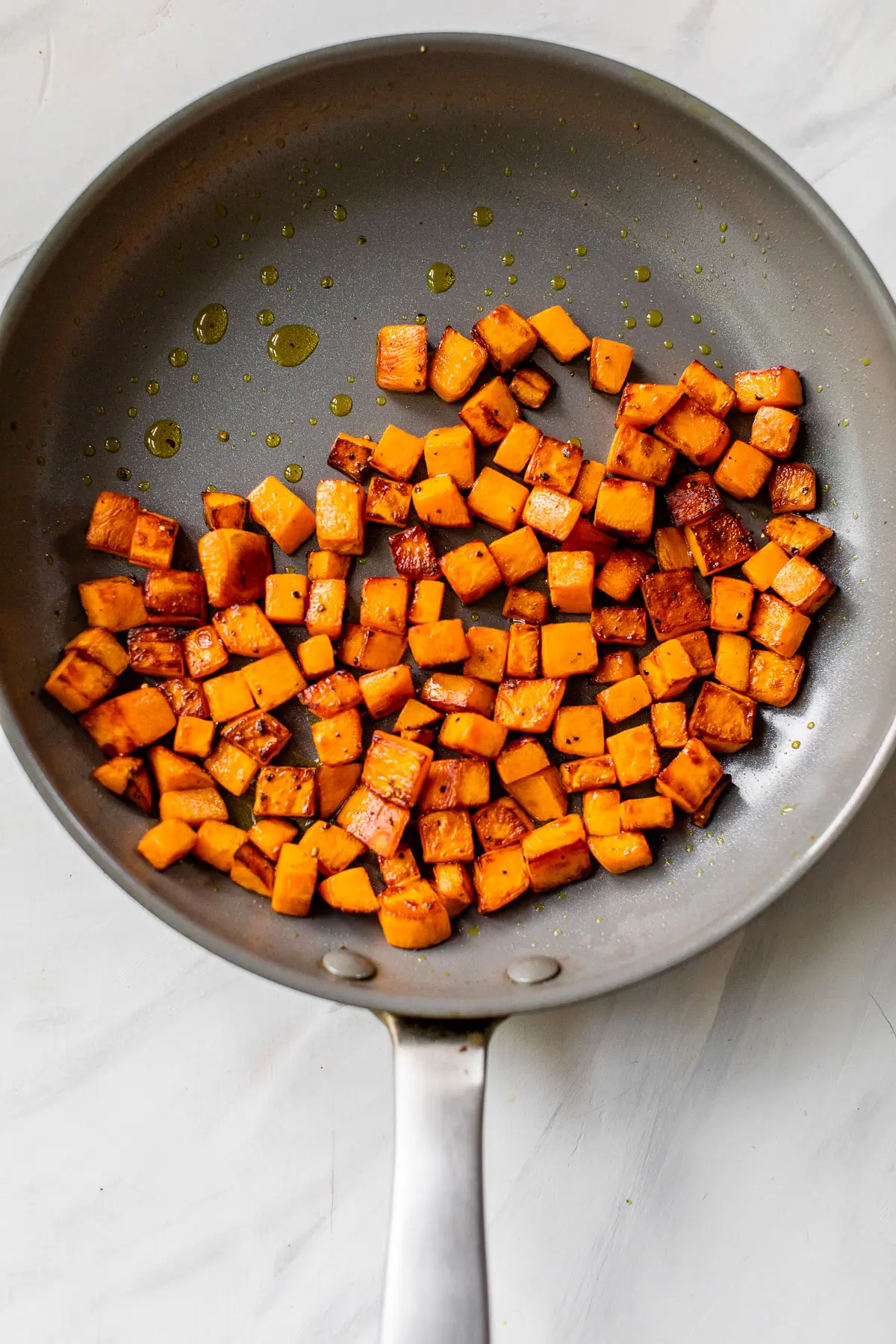 diced sweet potatoes in a skillet