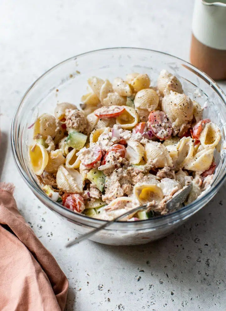 creamy tuna pasta salad in a glass bowl