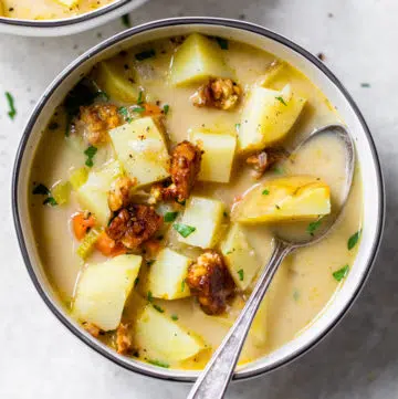 bowl of potato soup with a spoon