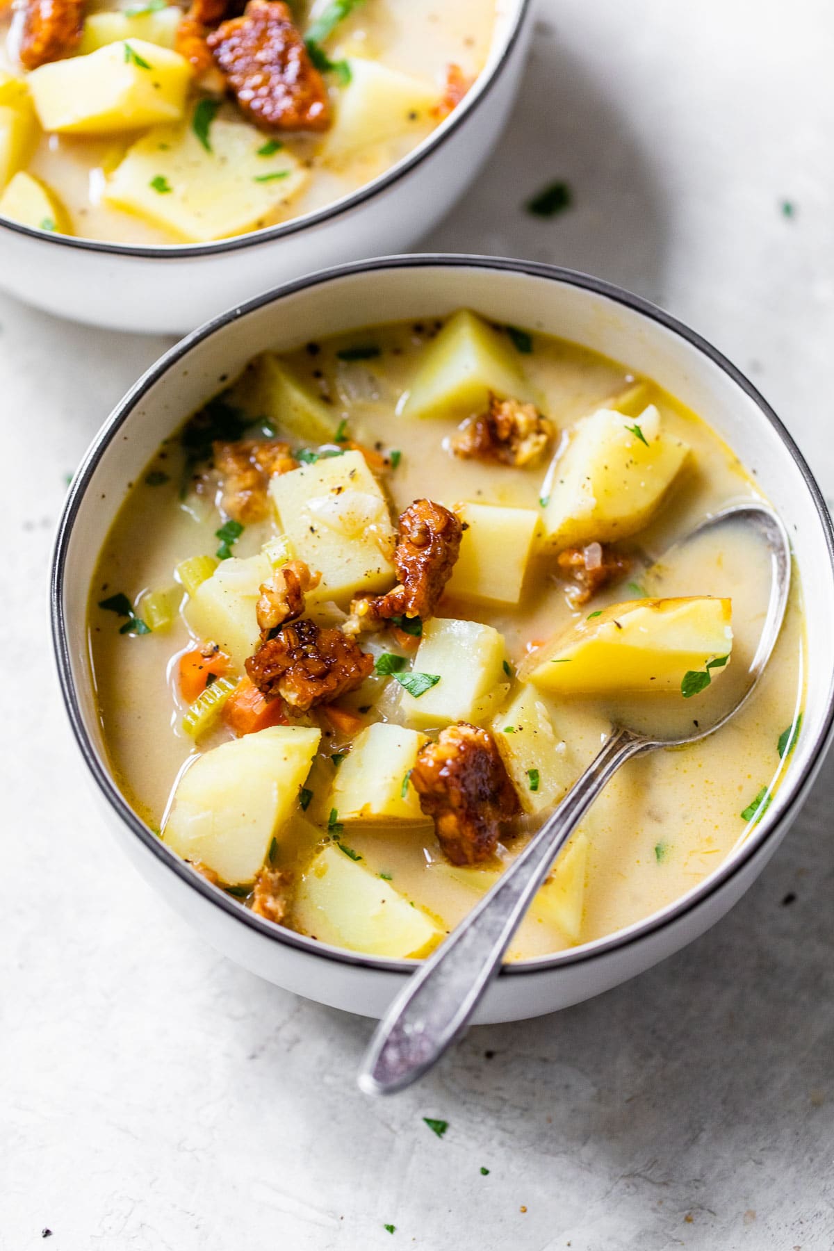 bowl of potato soup topped with cooked tempeh