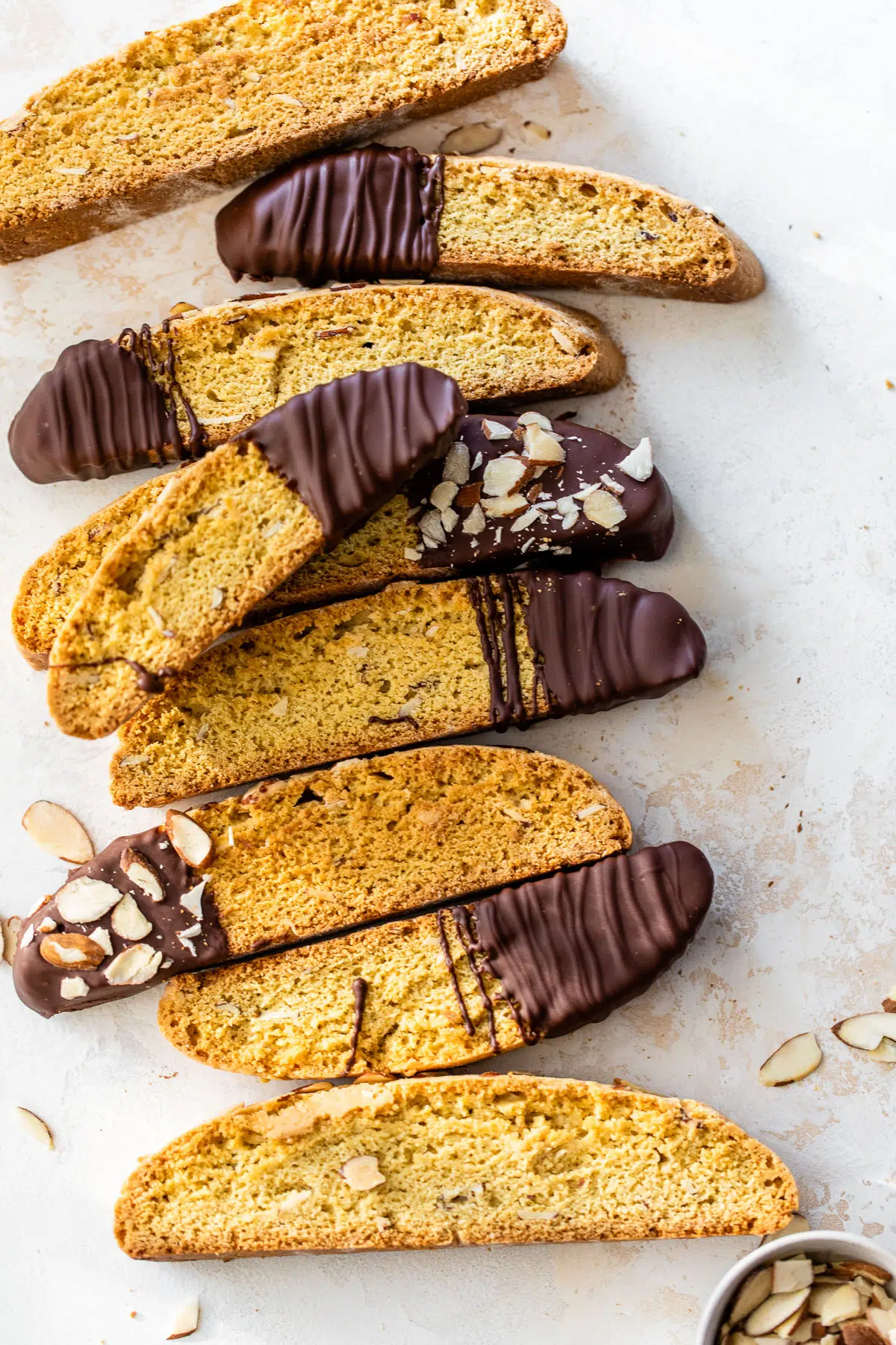 biscotti dipped in chocolate and coated in sliced almonds