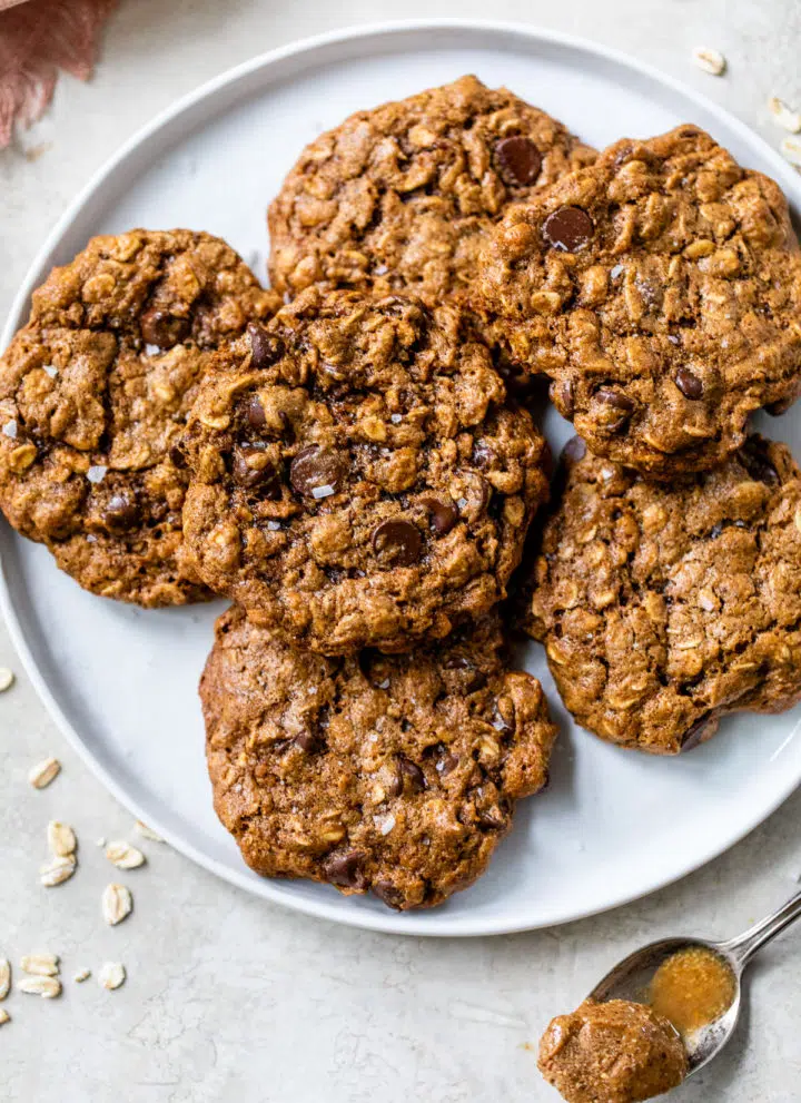 a plate of almond butter oatmeal cookies with chocolate chips