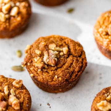 pumpkin muffins topped with walnuts