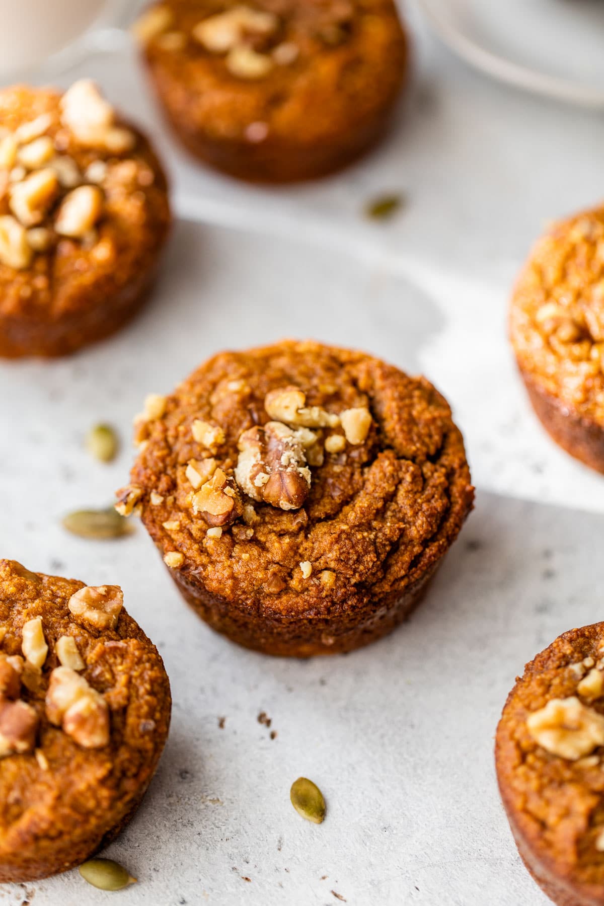 pumpkin muffins topped with walnuts