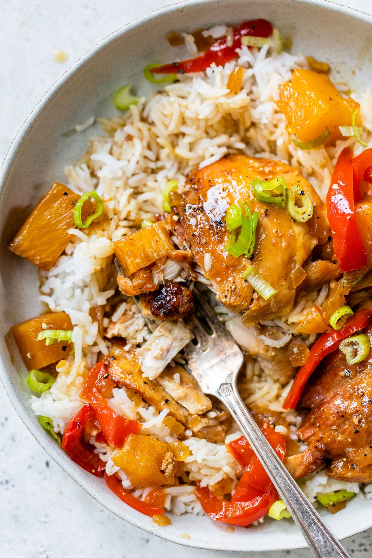 hawaiian chicken in a bowl over white rice