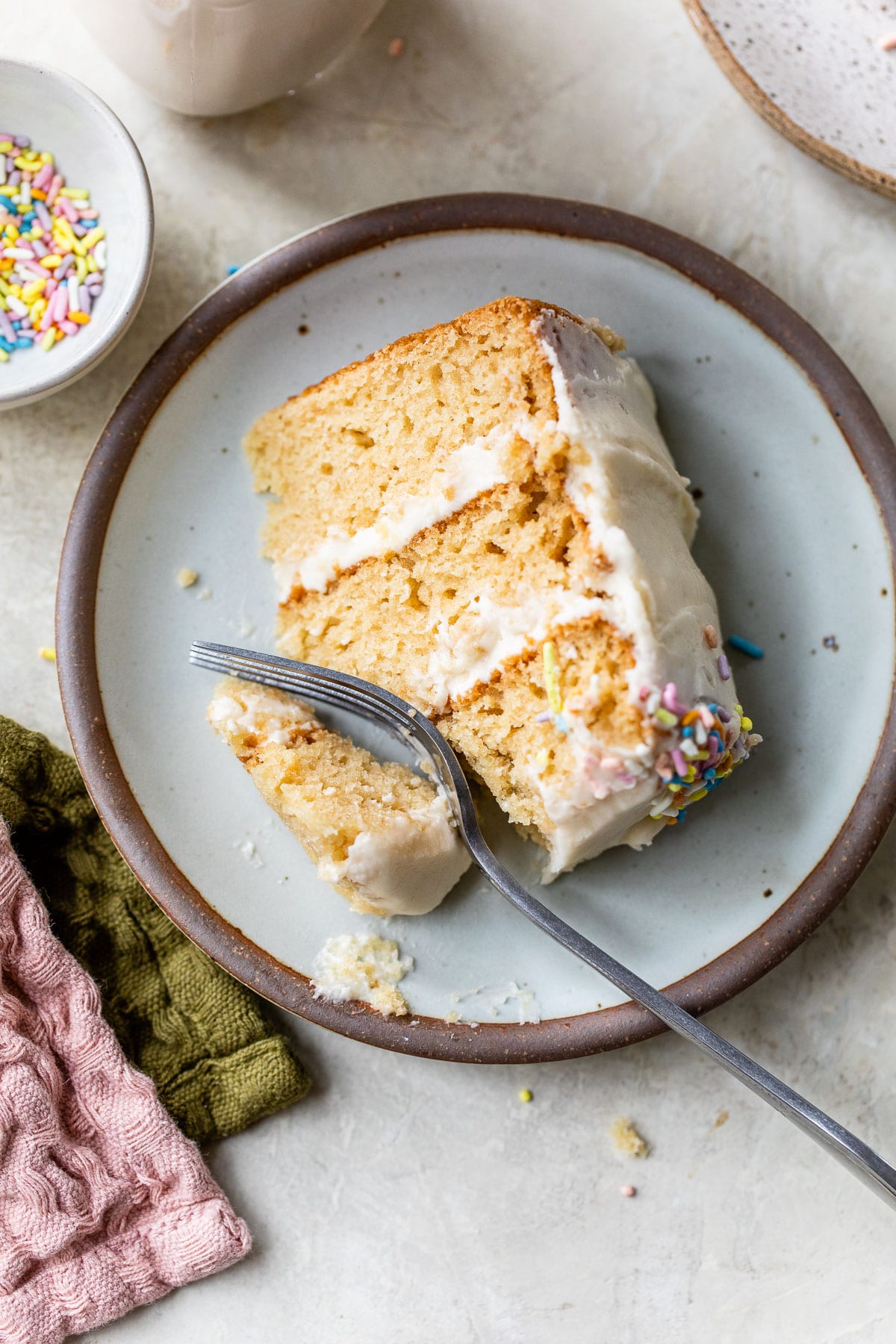 a slice of vegan vanilla cake on a plate