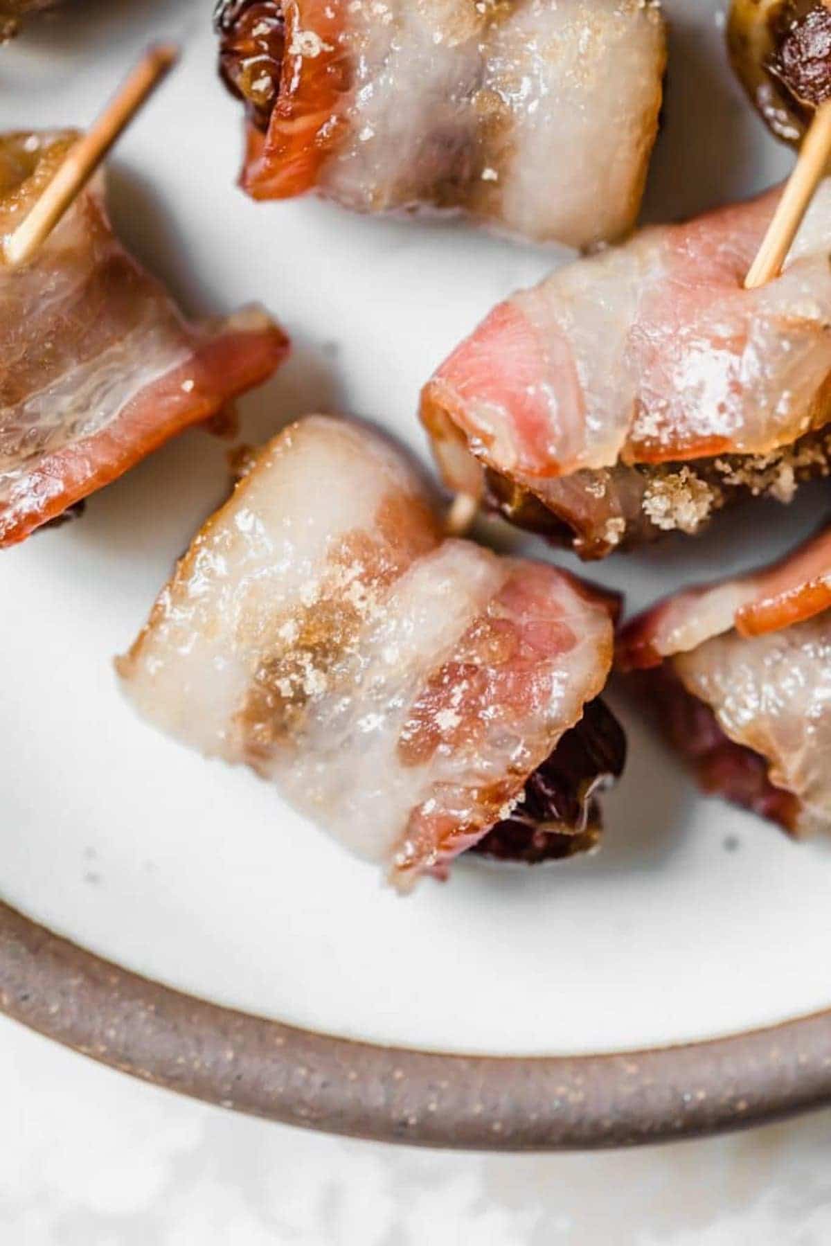bacon-wrapped date on a plate
