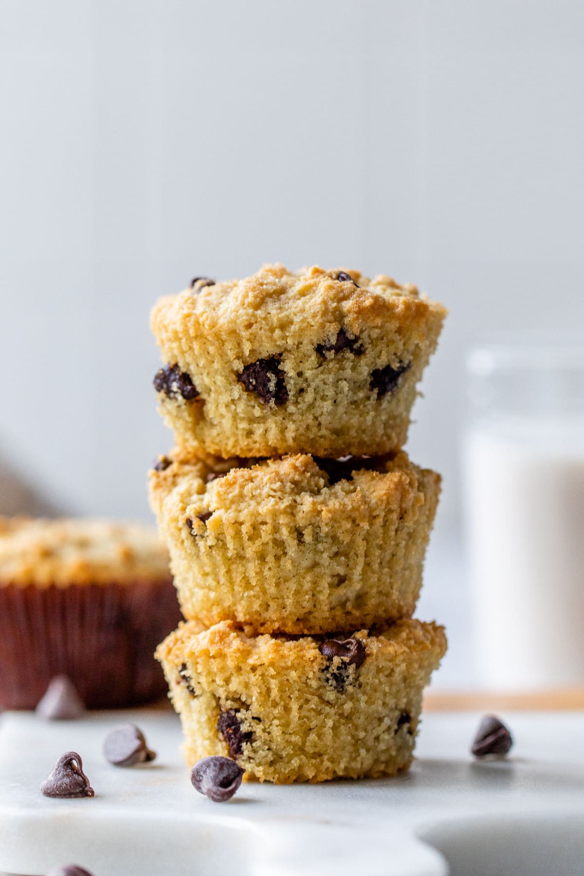 a stack of three muffins with chocolate chips