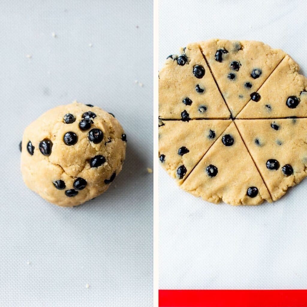 dough filled with blueberries on a silpat mat