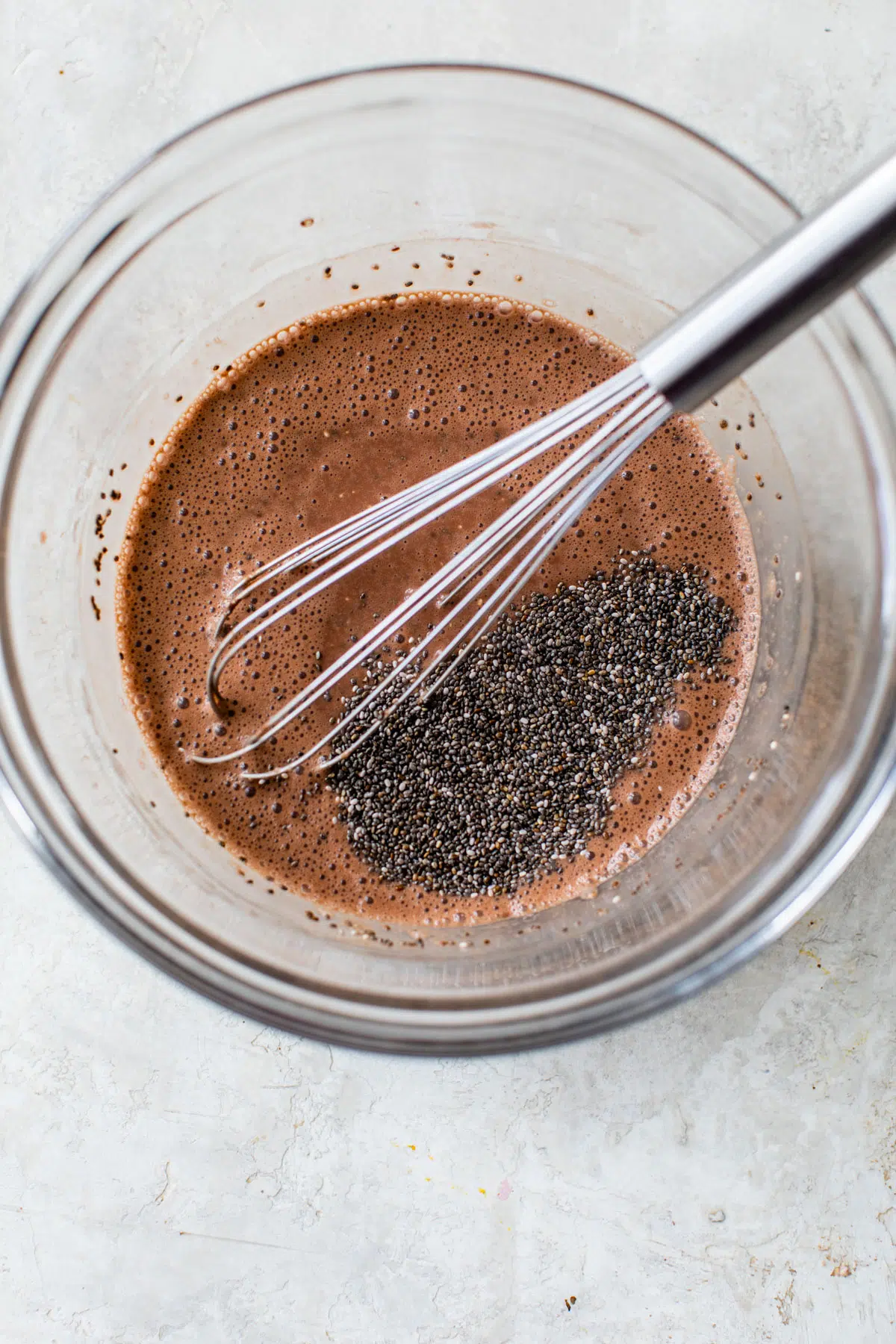 glass bowl with chocolate milk and chia seeds