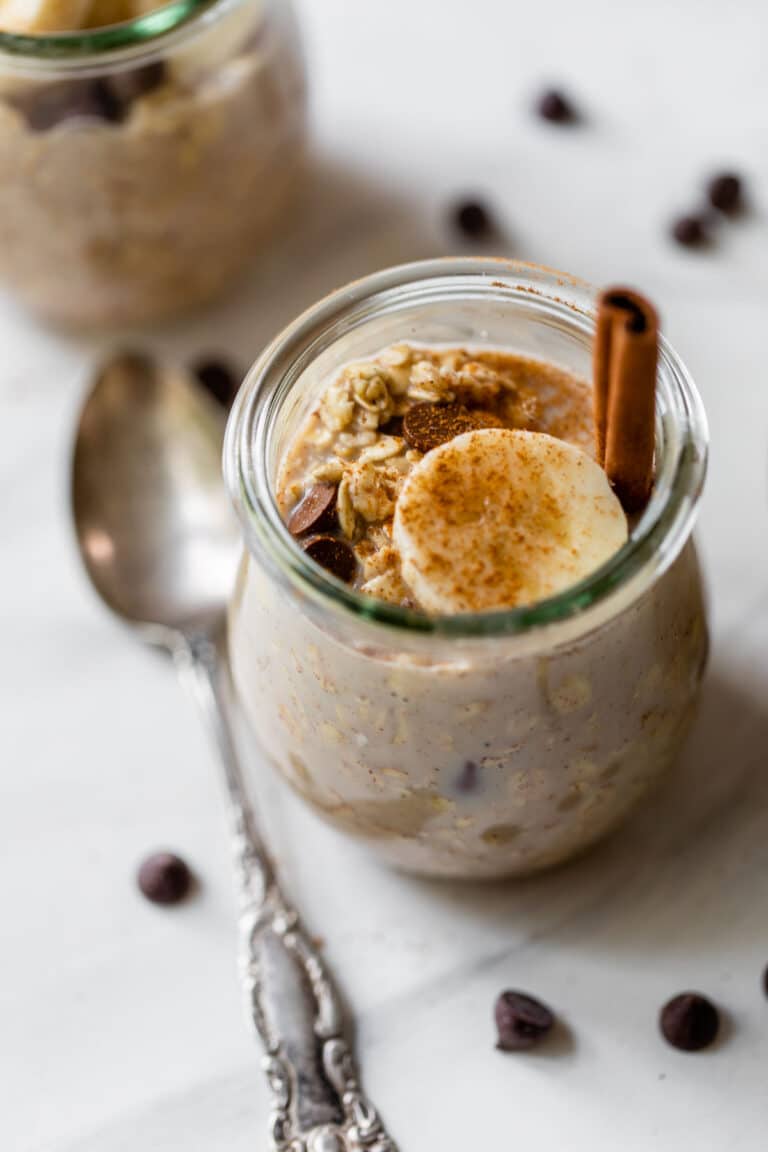overnight oats in a jar with sliced banana and chocolate chips