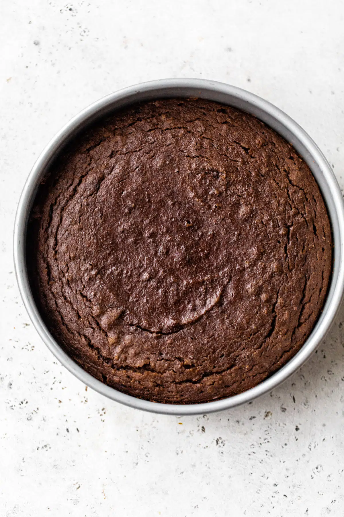 baked chocolate cake in a round cake pan