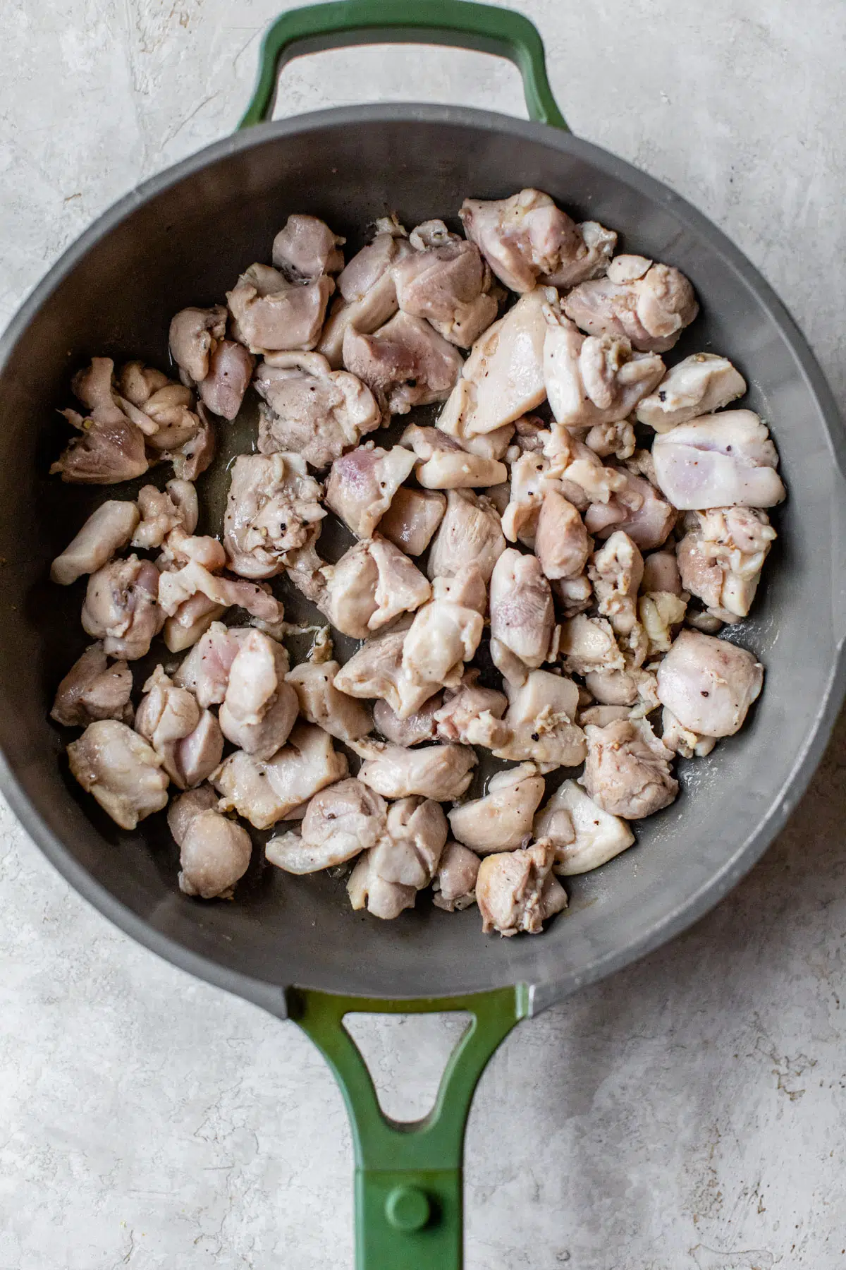 diced cooked chicken in a skillet