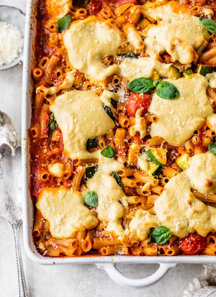 casserole dish filled with pasta, marinara sauce and cheese