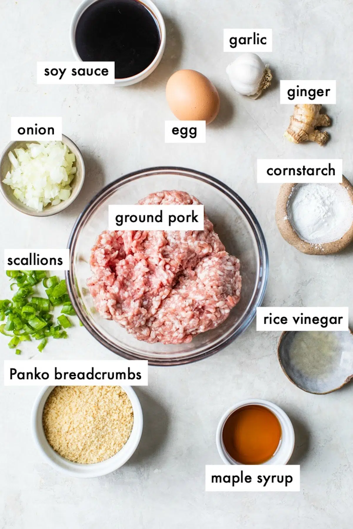 ingredients to make meatballs like ground pork, soy sauce and breadcrumbs