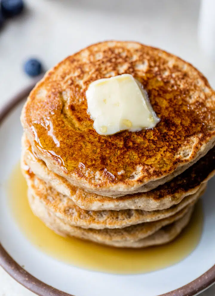 pancakes topped with butter and maple syrup