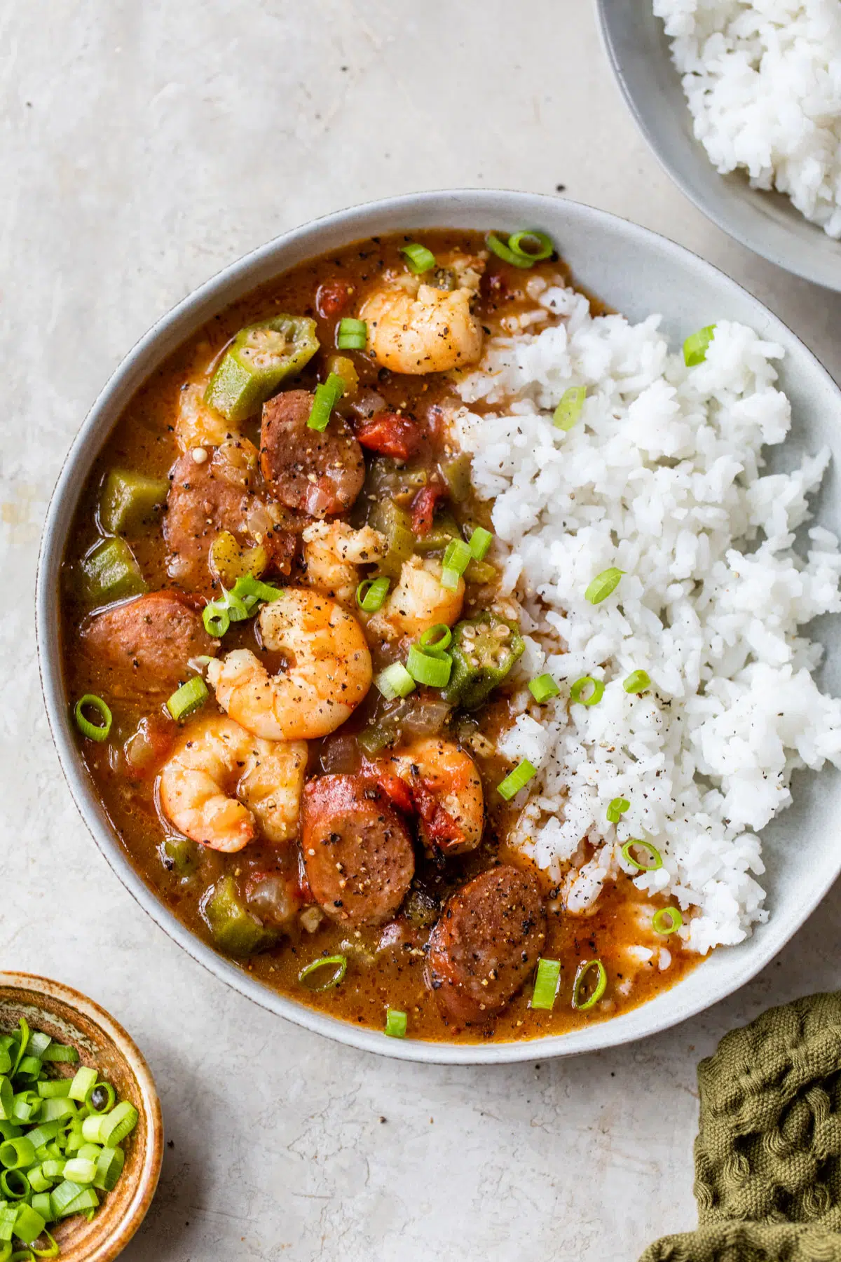 a large bowl of shrimp and sausage gumbo with rice