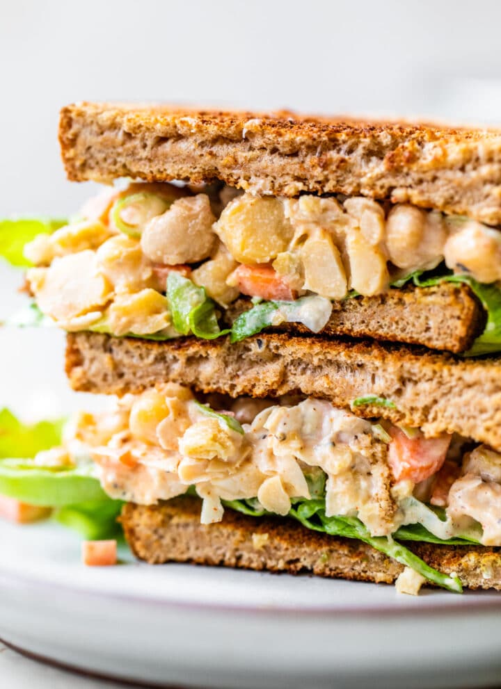 chickpea chicken salad on a sandwich on a plate