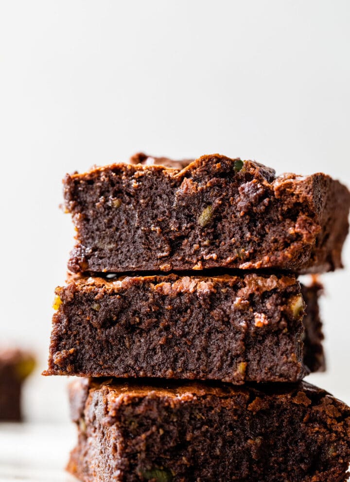 a stack of three fudgy brownies