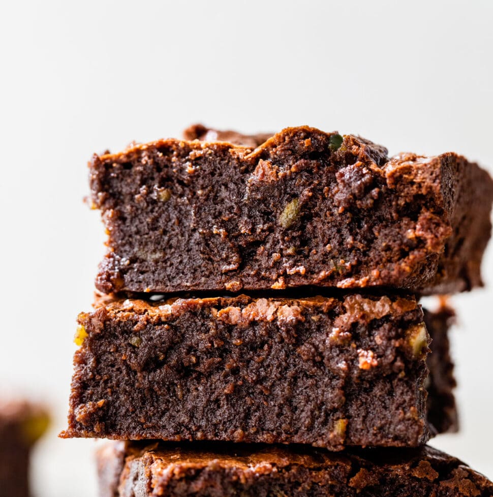 a stack of three fudgy brownies
