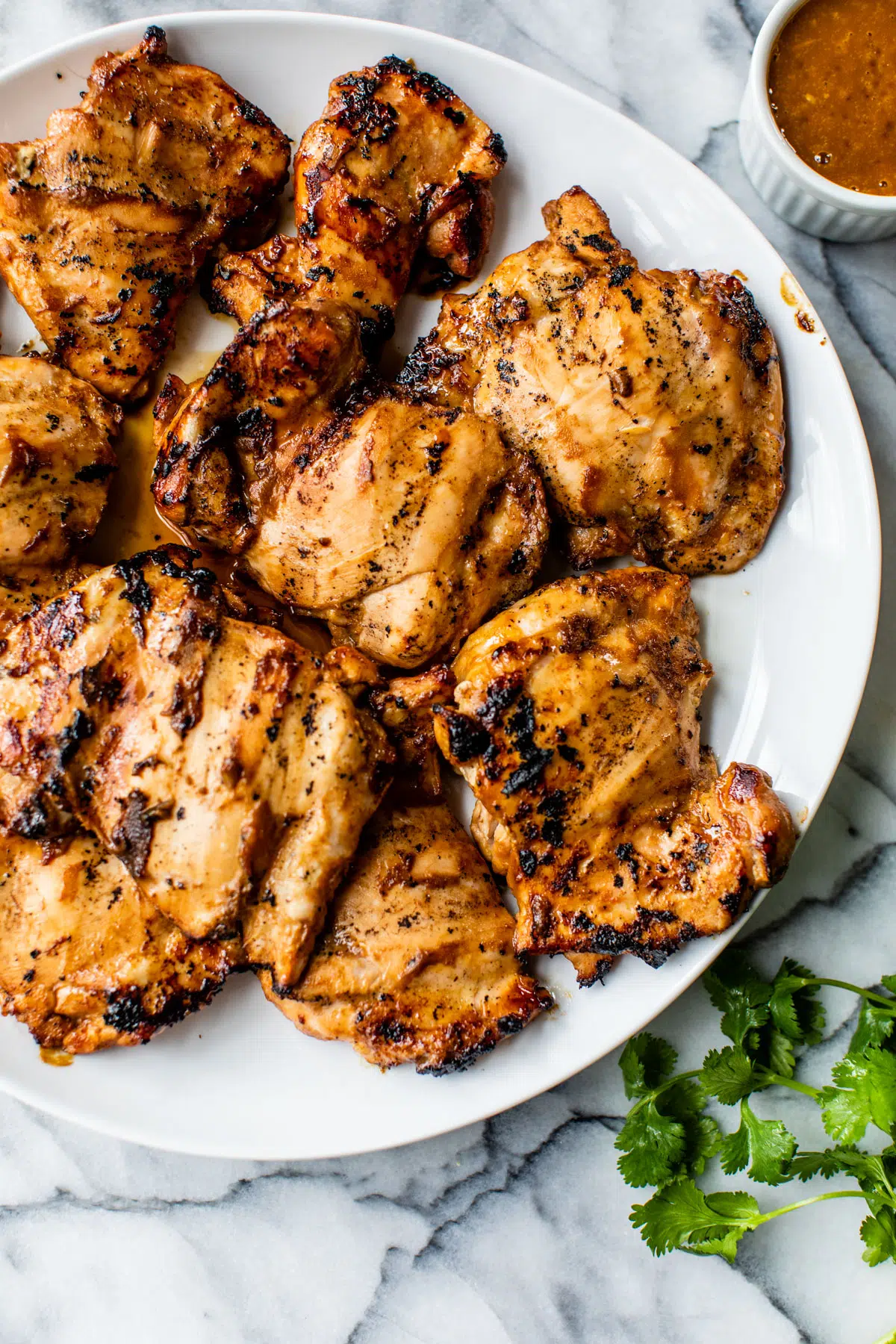 grilled chicken thighs on a platter