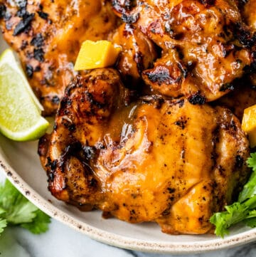 mango chicken thighs on a plate