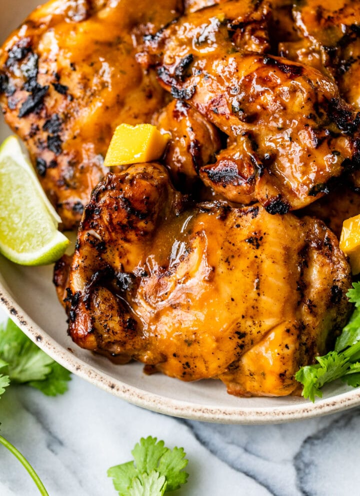 mango chicken thighs on a plate