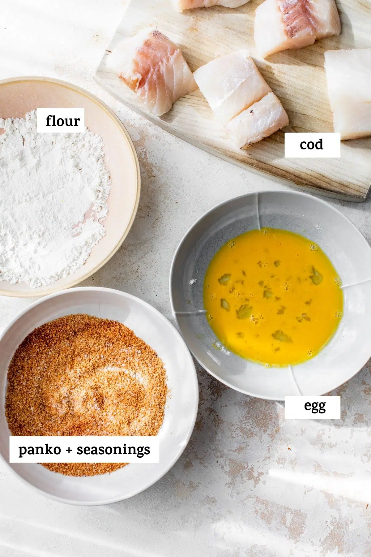 ingredients to make a cod sandwich, like cod fillets and breadcrumbs