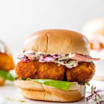 fried cod sandwich with lettuce and coleslaw