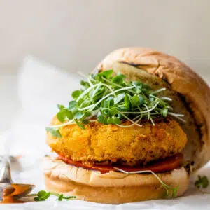 chickpea burger on a bun with microgreens