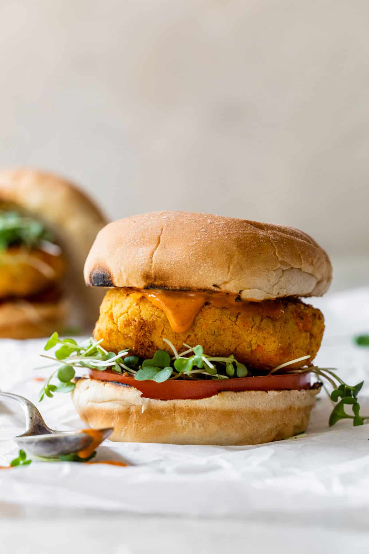 chickpea burger on a bun with parchment