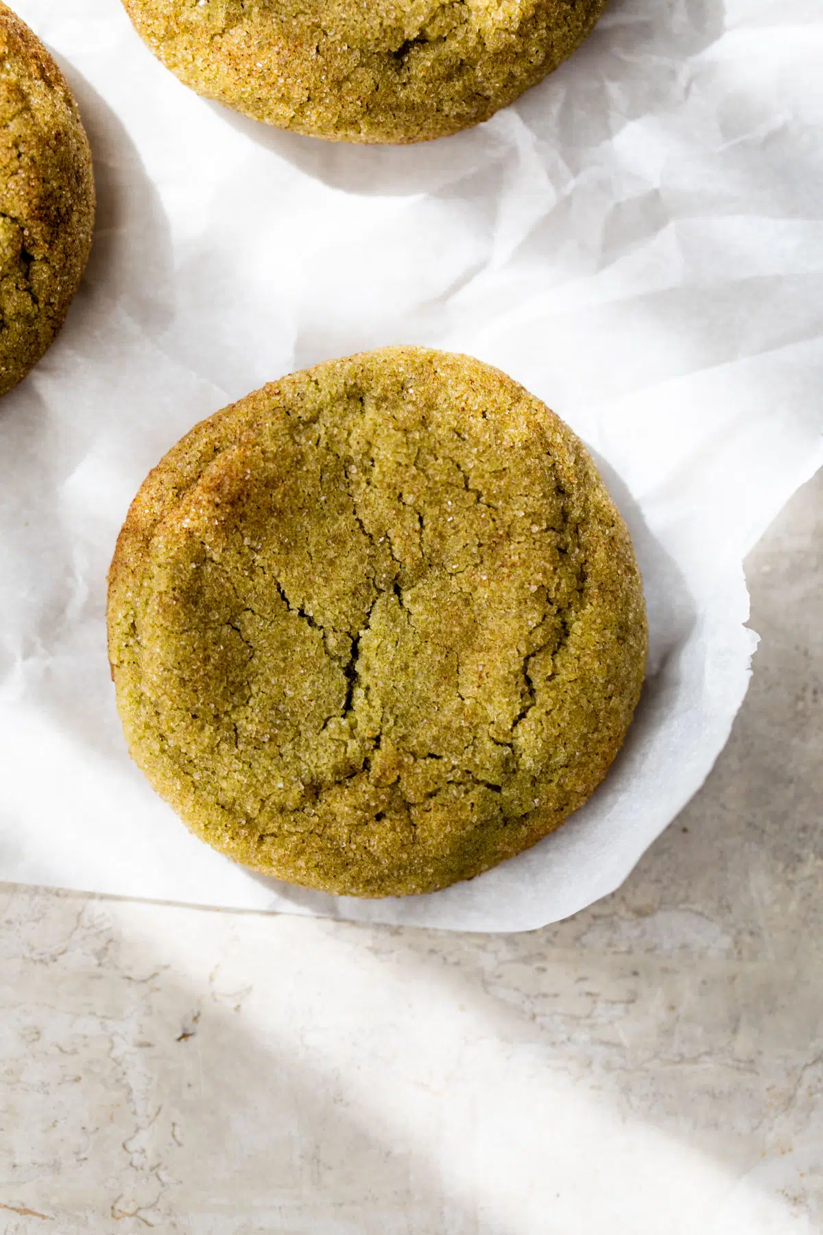 close up photo of a green snickerdoodle cookie