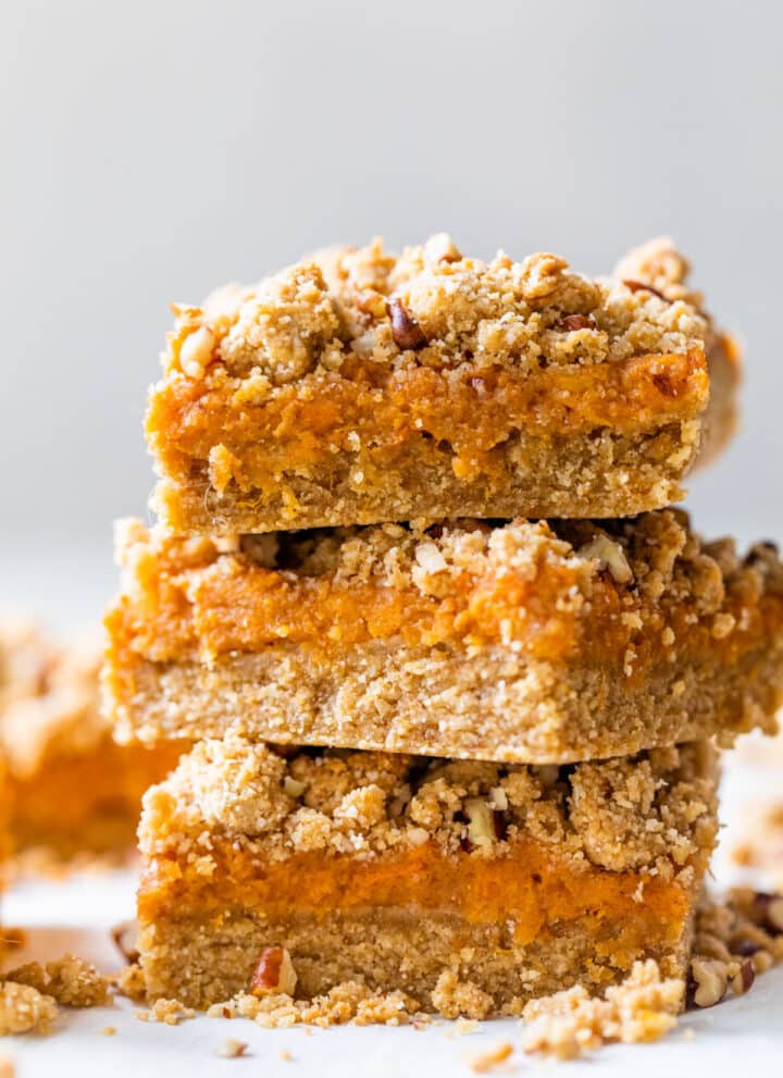 a stack of three bars with sweet potatoes and a crumb topping