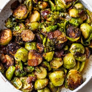 roasted brussels sprouts in a bowl with bacon
