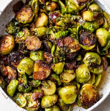 roasted brussels sprouts in a bowl with bacon