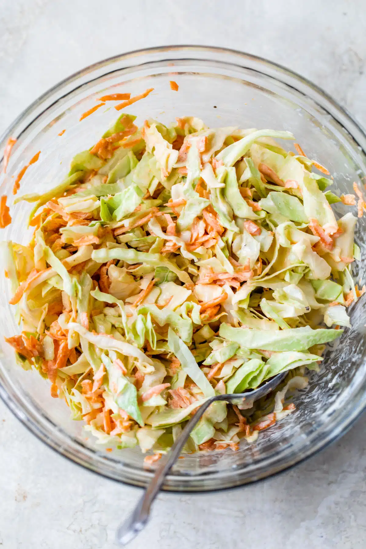 large glass bowl with coleslaw