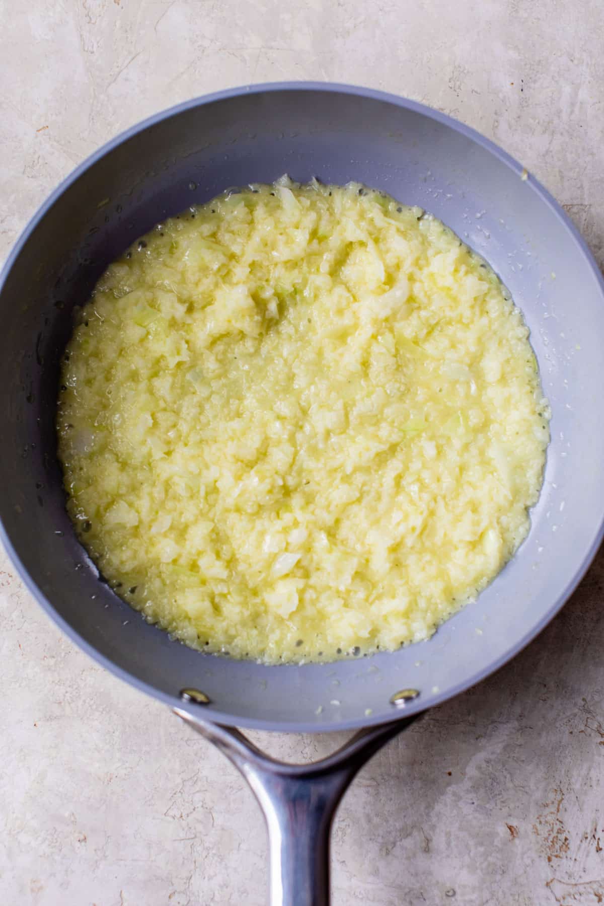 butter and diced onion in a skillet
