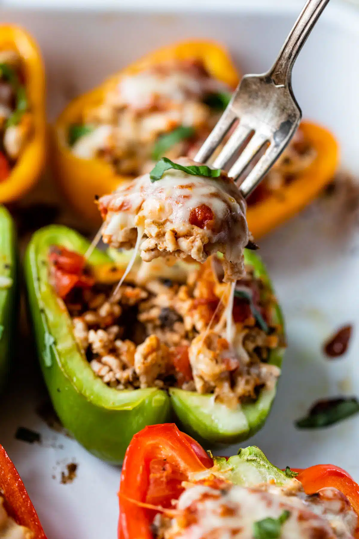 photo of a fork holding a bite of a finished stuffed pepper