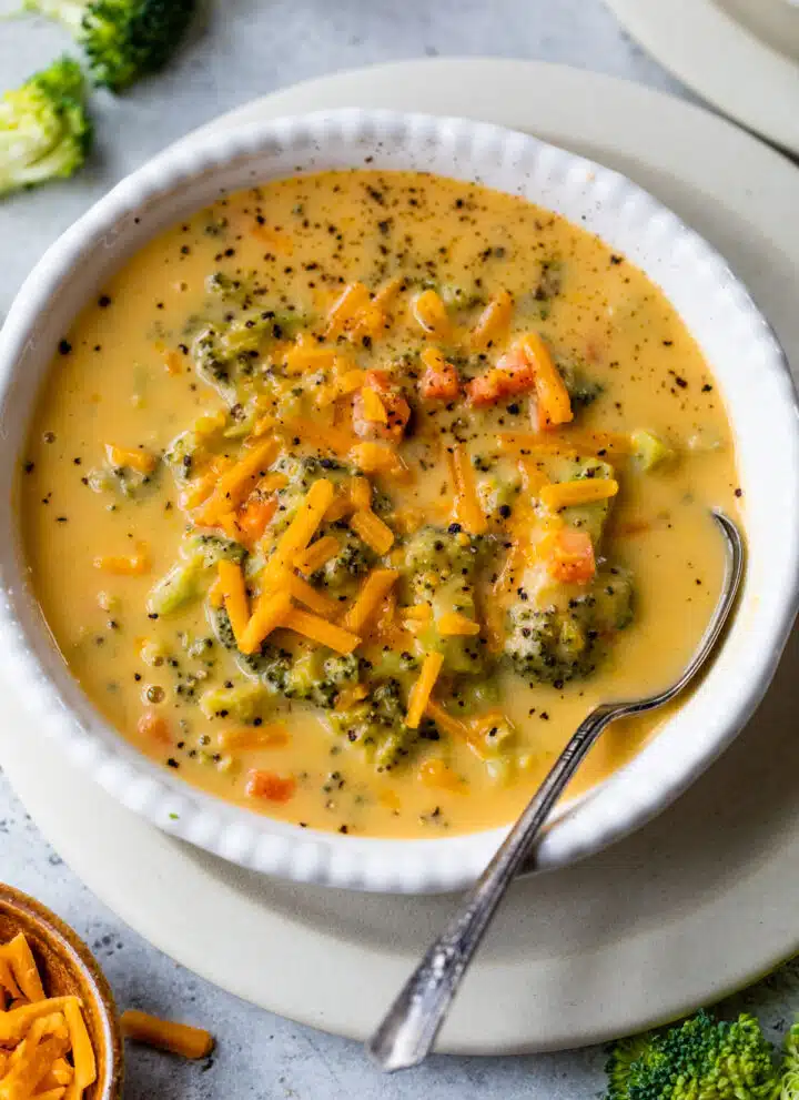 bowl of broccoli cheddar soup with a spoon