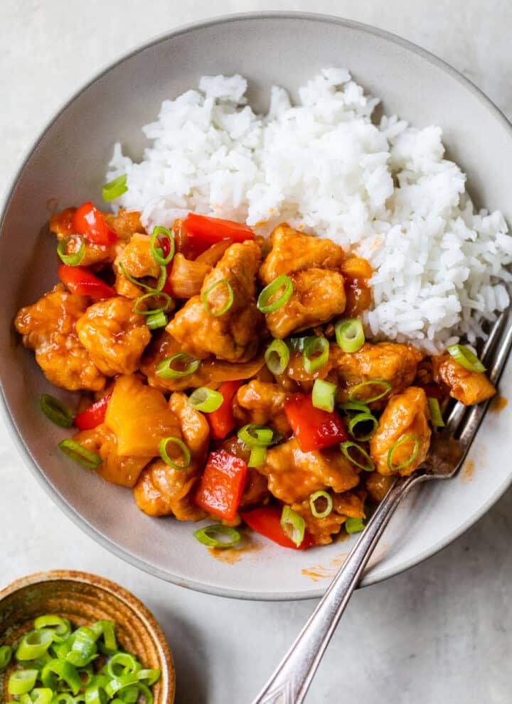 bowl of rice with sweet and sour chicken