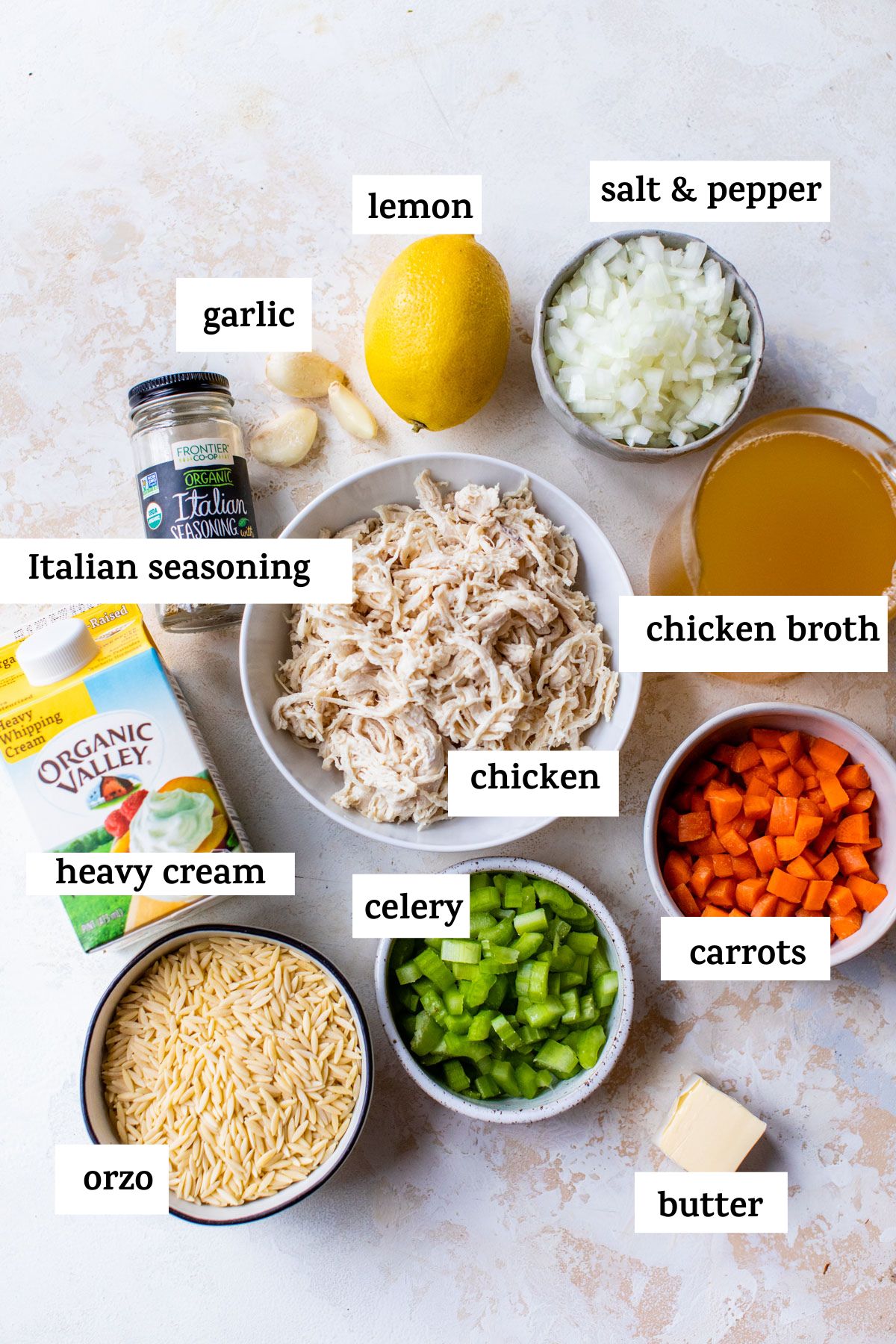 ingredients to make chicken orzo soup, like orzo, shredded chicken and chicken broth