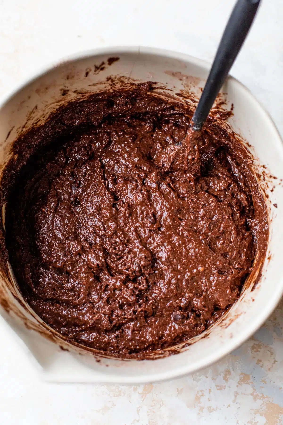a bowl with vegan chocolate muffin batter inside
