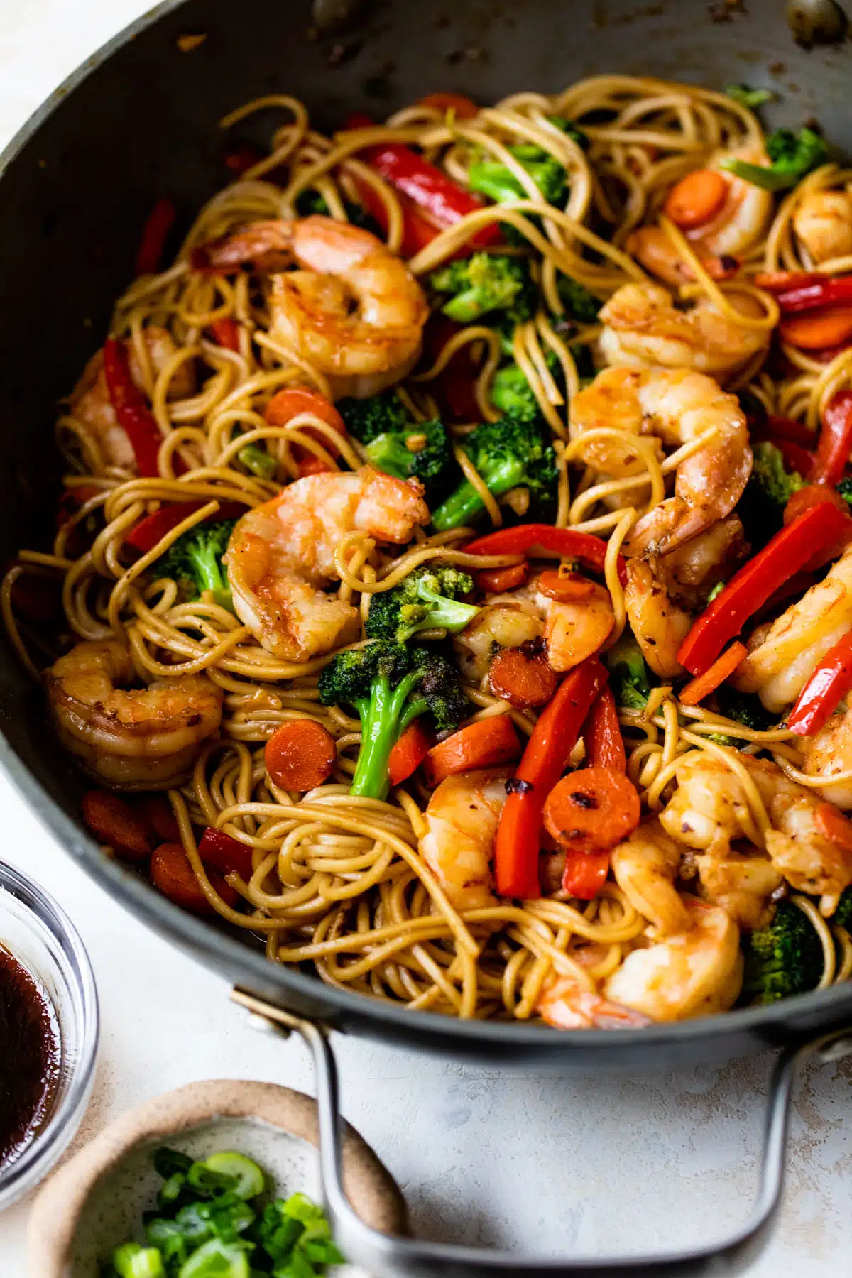 close up of shrimp lo mein in a skillet