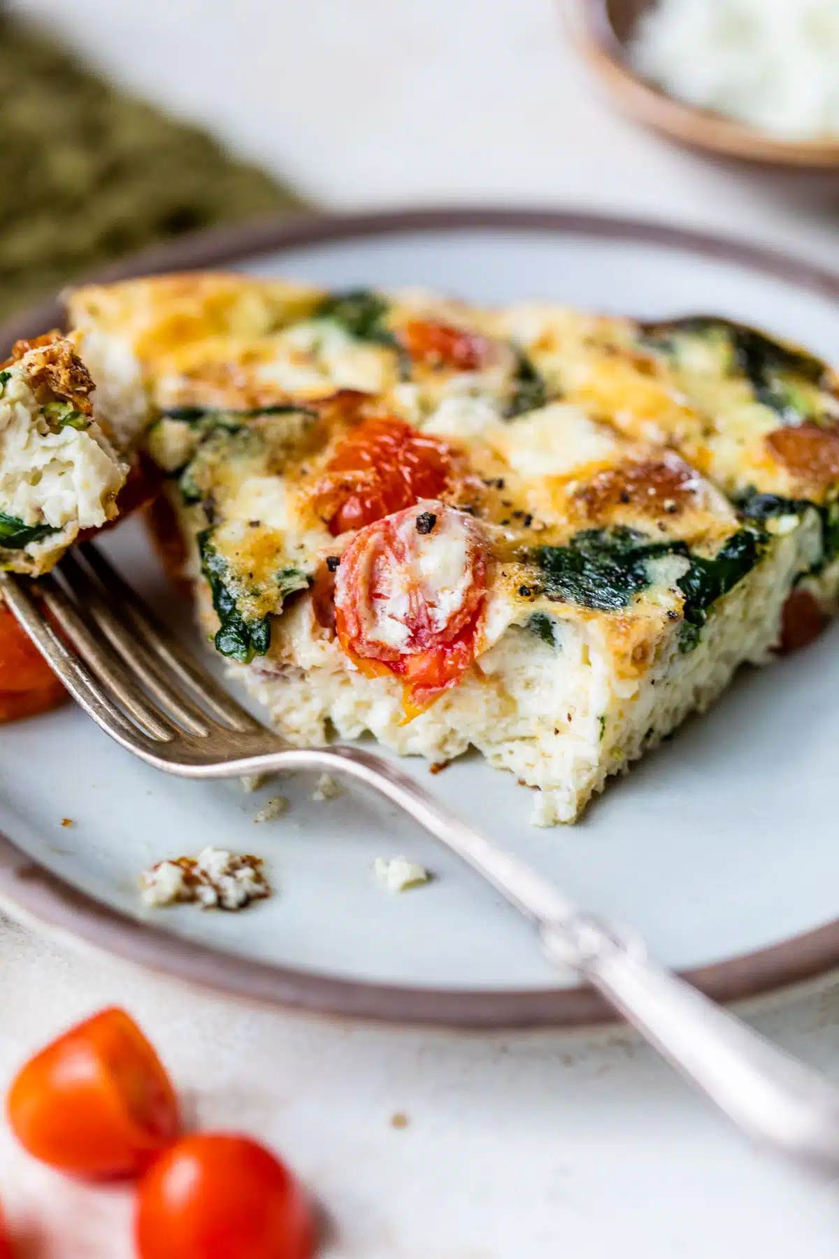 a slice of egg white frittata on a plate with a fork
