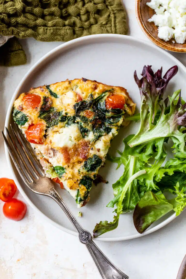 a slice of egg white frittata on a plate with a fork
