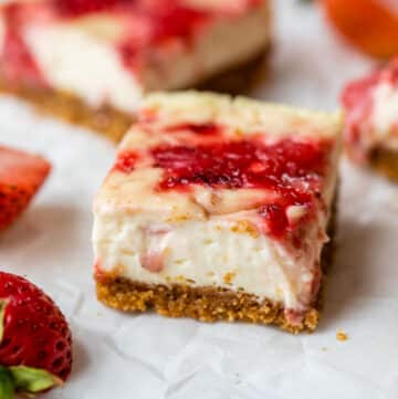 cheesecake in the shape of a bar on parchment paper